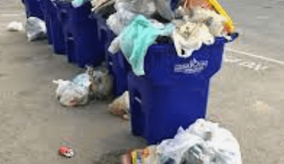 Image of trash overflowing that can lead to the great pacific garbage patch.