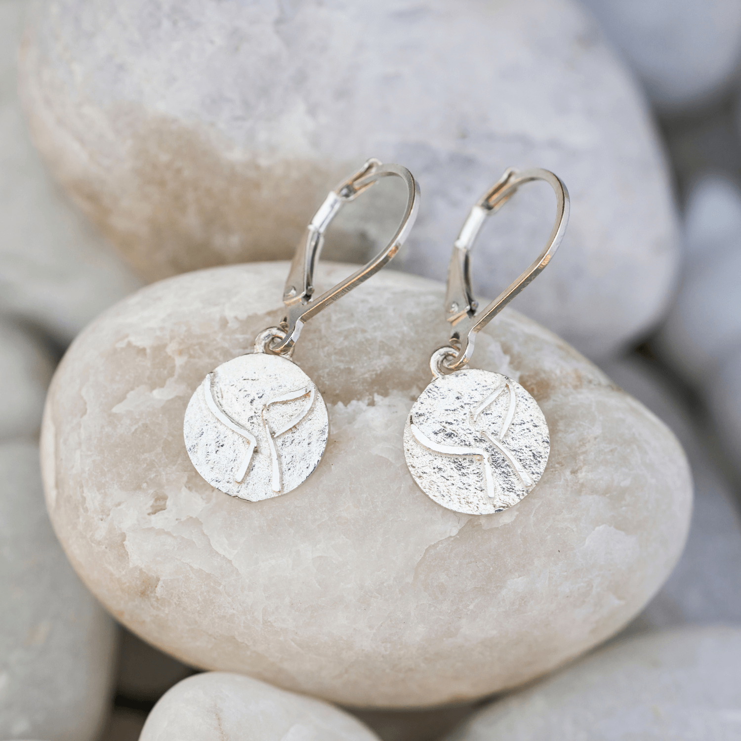 Embossed whale tail earrings